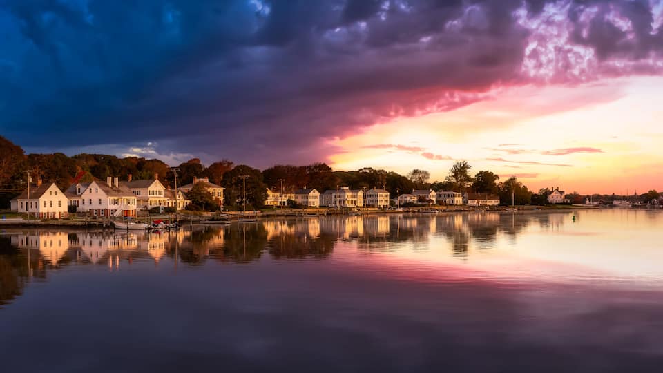 Panoramic view of residential homes by the Mystic River. Colorful Magical Sunrise Sky Art Render. Taken in Mystic, Stonington, Connecticut, United States.