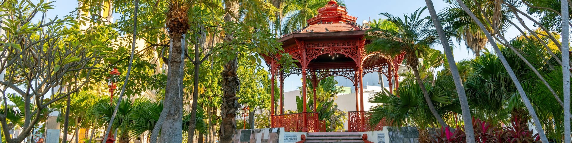 The historic Plaza Republica Square and gazebo kiosk, with the Immaculate Conception church in view, in the historic center of Mazatlan, Mexico.