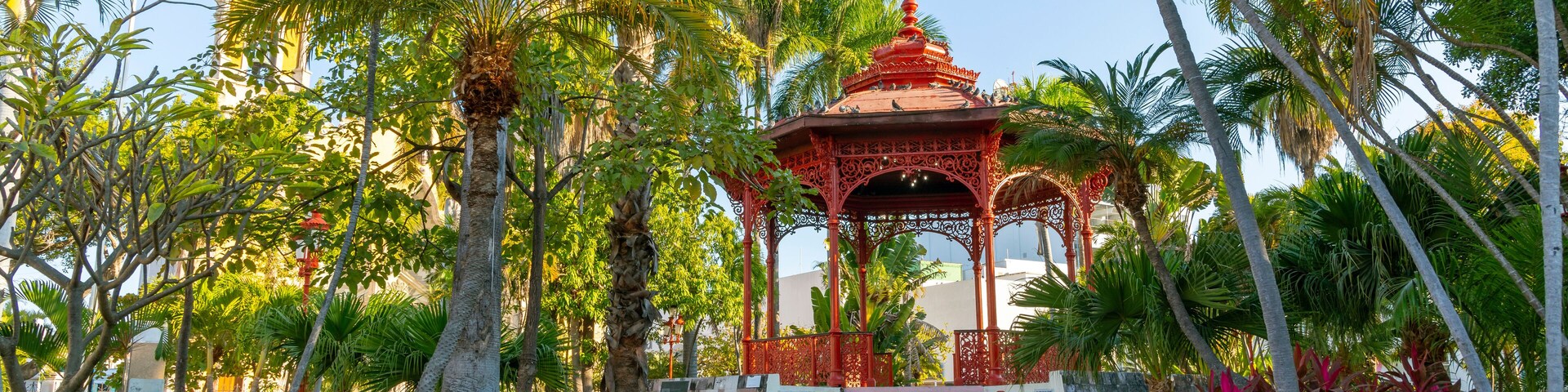 The historic Plaza Republica Square and gazebo kiosk, with the Immaculate Conception church in view, in the historic center of Mazatlan, Mexico.