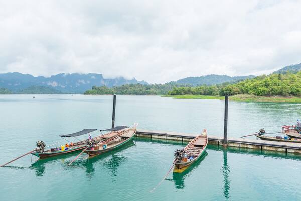 Boats are docked at the marina in Ratchaprapha dam, Surat Thani,