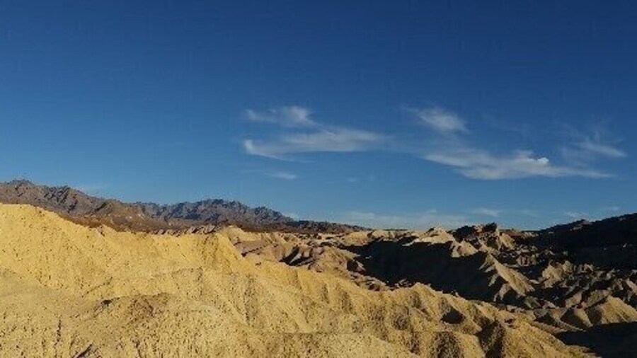Golden Canyon Trail in Death Valley National Park will let you listen to the sound of silence in the hottest, driest, lowest National Park in the world.
It also leads to a spectacular view of Death Valley and Zabriskie Point.
Death Valley National Park has the lowest recorded possible decibel level! And the record for the hottest temperature ever recorded on Earth (134F), the lowest land point in the western hemisphere