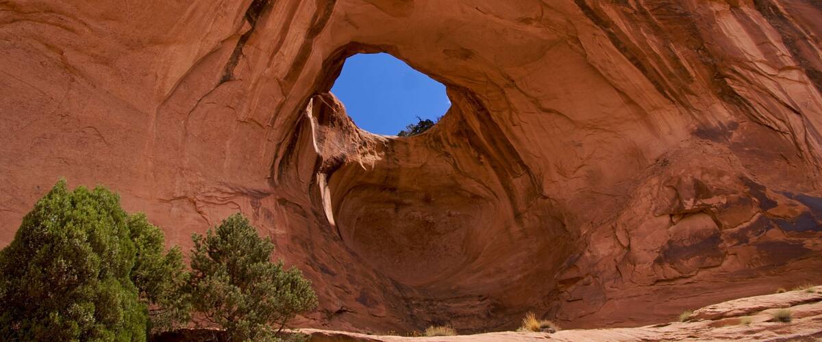 Bowtie Arch, a pothole arch from pothole broken through, Moab