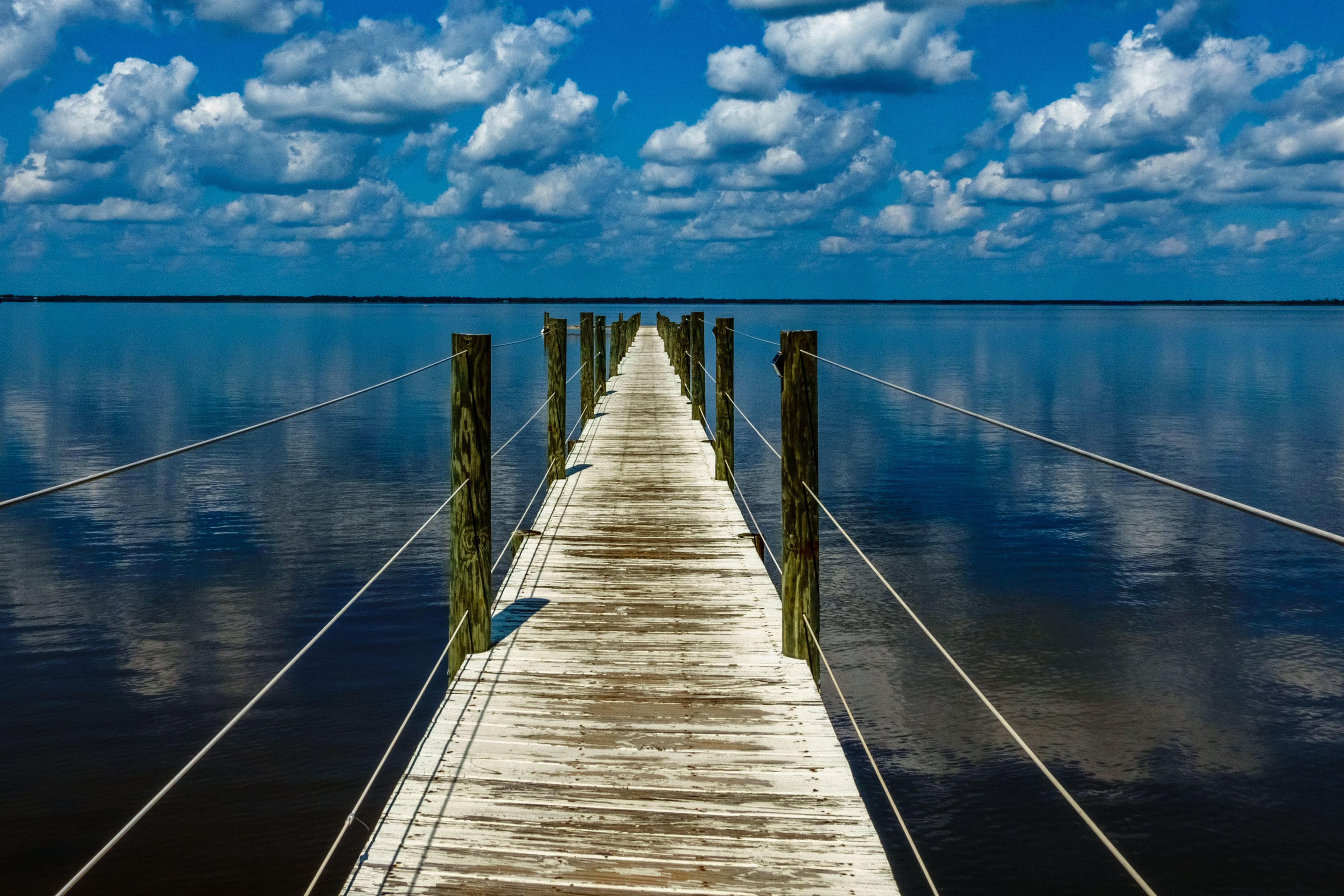 Reflected Clouds Over Choctawatchee Bay Dock