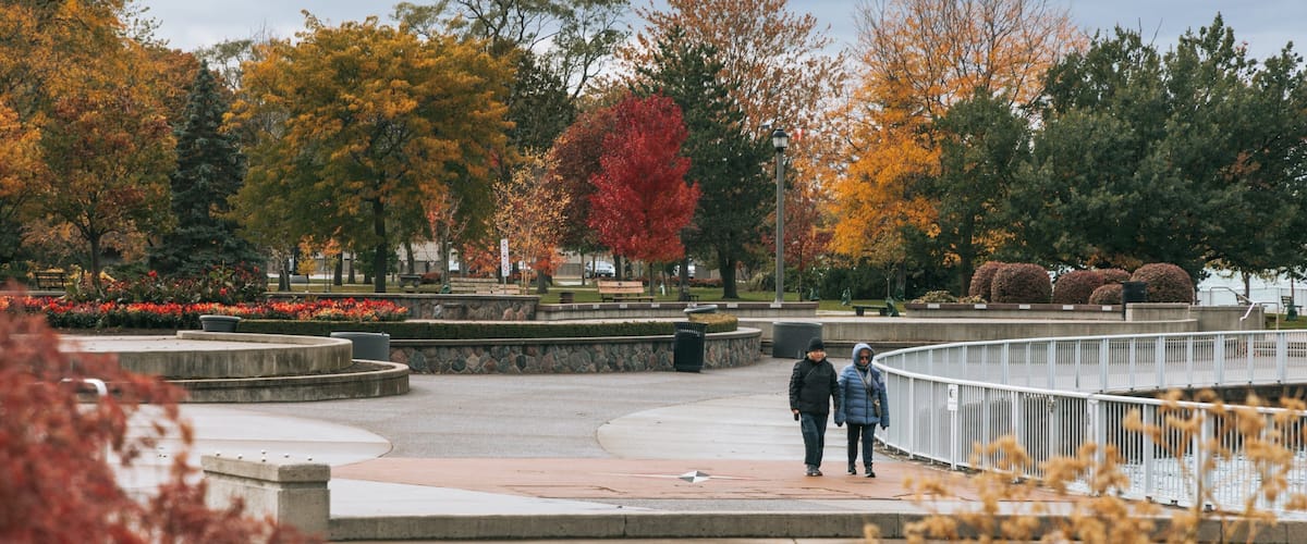 Reaume Park and Coventry Gardens Walking Trails Trailhead featuring street scenes, fall colors and a park