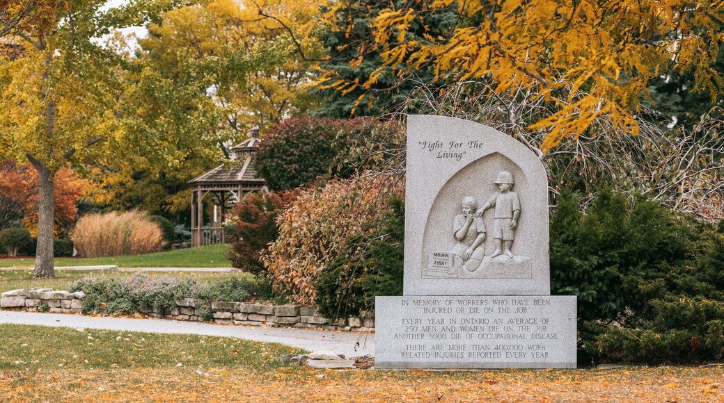 Reaume Park and Coventry Gardens Walking Trails Trailhead which includes a park and autumn leaves