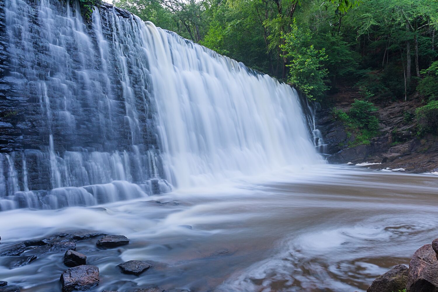 A beautiful feature about the Atlanta Metro area is that it is not devoid of all green space. The Southern cities in the United States have embraced nature as they develop. Vickery Creek Falls is one such park that the city seems to melt away and you are transported right into nature. The trails are fairly easy to navigate and the inclines are gentle making for a stress free, picturesque stroll along side the banks of Big Creek. For a little more challenge complete the 4.7 loop that will take you past the spillway waterfall, historic mill and across a covered bridge.  All this beauty is located right in the heart of Roswell just outside of Atlanta.