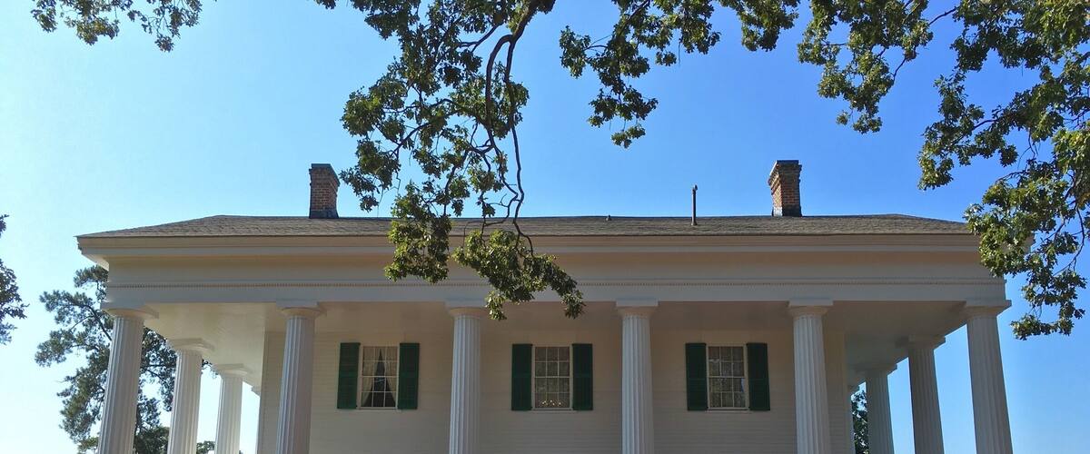 In the 1830s, Barrington King and his father, Roswell King, co-founded the colony which became Roswell, Georgia. In 1839 on the highest point, overlooking the town, Barrington built a magnificent home for his family which today is recognized as one of the best examples of Greek Revival architecture in the United States.