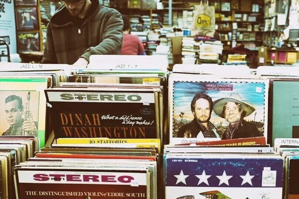 A music store with vinyl records and CDs on display.