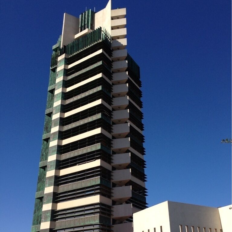 The only Frank Lloyd Wright skyscraper design ever realized, the Price Tower, a 19-story building housing a mix of apartments, offices, and the HQ of the Price Company, was completed in 1956. Today, it's an Inn, a few offices, and a historical site/museum/tour. 