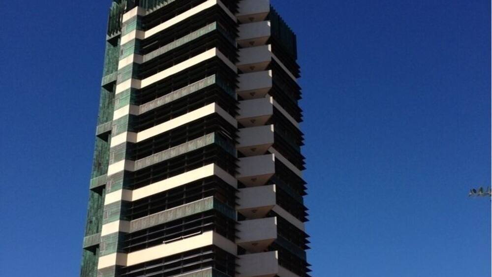 The only Frank Lloyd Wright skyscraper design ever realized, the Price Tower, a 19-story building housing a mix of apartments, offices, and the HQ of the Price Company, was completed in 1956. Today, it's an Inn, a few offices, and a historical site/museum/tour.