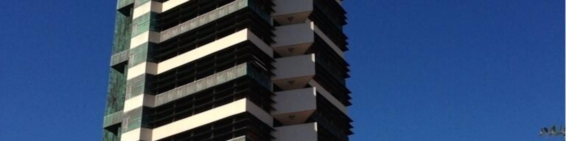 The only Frank Lloyd Wright skyscraper design ever realized, the Price Tower, a 19-story building housing a mix of apartments, offices, and the HQ of the Price Company, was completed in 1956. Today, it's an Inn, a few offices, and a historical site/museum/tour.