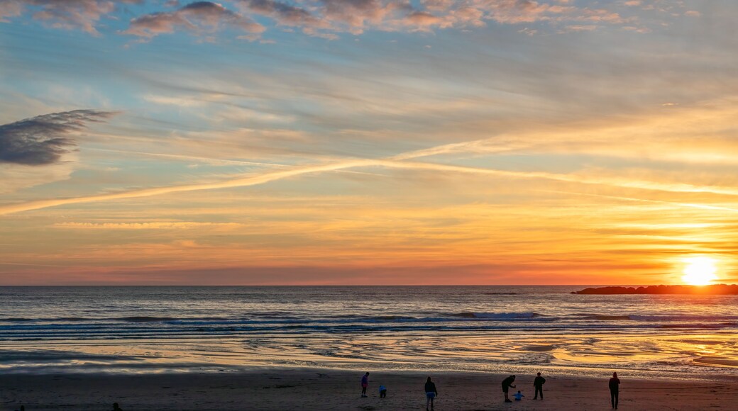Sunset at Beverly Beach with family playing on the shore
