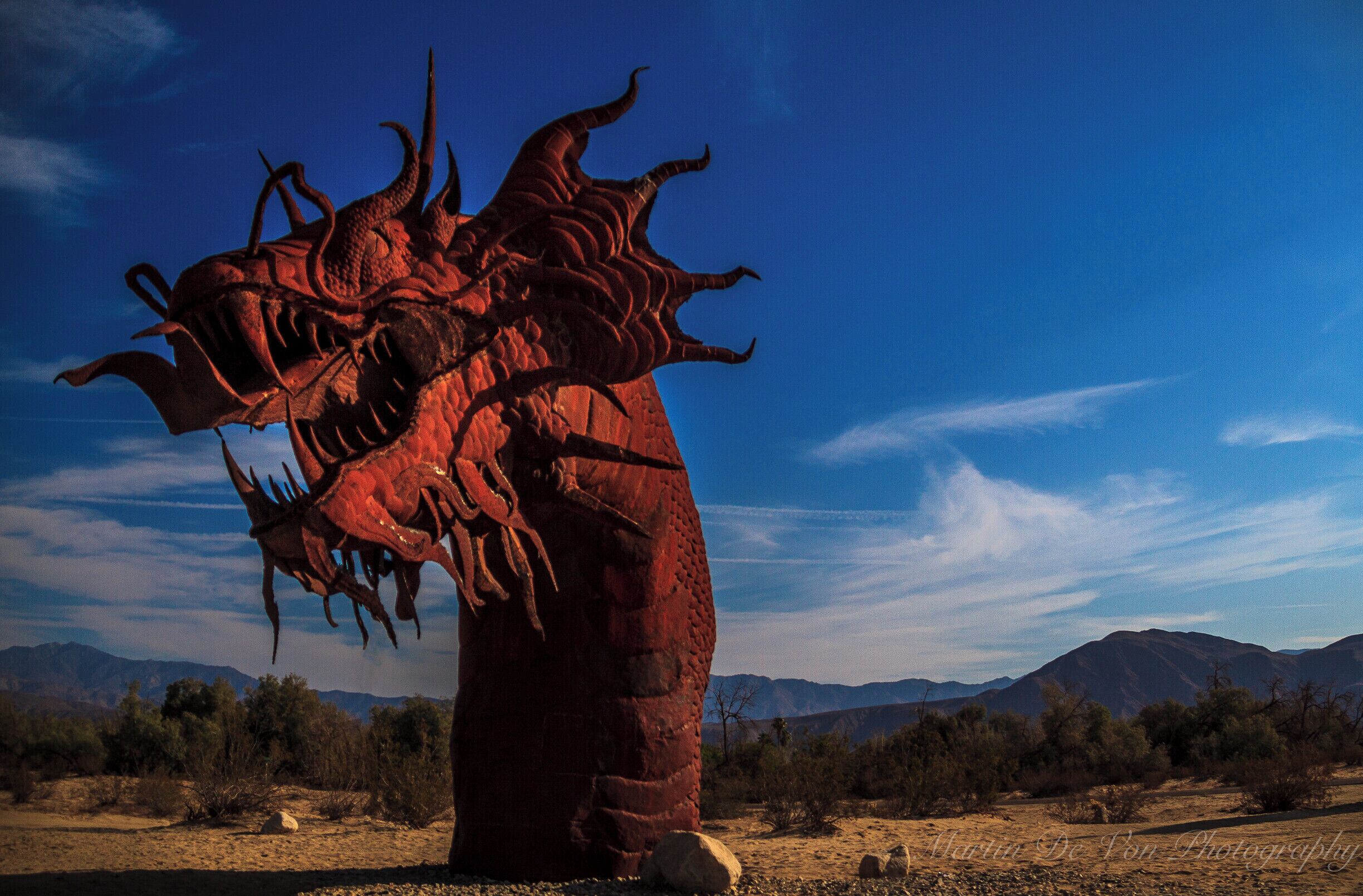 Something more than desert wildflowers and the spectacular Anza-Borrego Desert State Park is attracting visitors to the Borrego Valley in Southern California. People are coming from around the United States and internationally to see the amazing 130 full-sized metal sculptures here that are inspired by creatures that roamed this same desert millions of years ago. The artworks range from prehistoric mammals to historical characters, fanciful dinosaurs, and a 350-foot-long fanciful serpent.

As you drive through the roads that weave through the area you'll see sculptures of wild horses in a nearby field, sabertooth tigers in pursuit, and desert tortoises that seem as if they're crawling through the brush. The artist, Ricardo Breceda, brings life to his sculptures by capturing each creature in motion. They are so still, yet all you see is movement.

The late Dennis Avery, land owner of Galleta Meadows Estates in Borrego Springs envisioned the idea of adding 'free standing art' to his property with original steel welded sculptures created by 'Perris Jurassic Park' owner/artist/welder Ricardo Breceda based in Perris, California. There are over 130 metal sculptures located in Borrego Springs. 