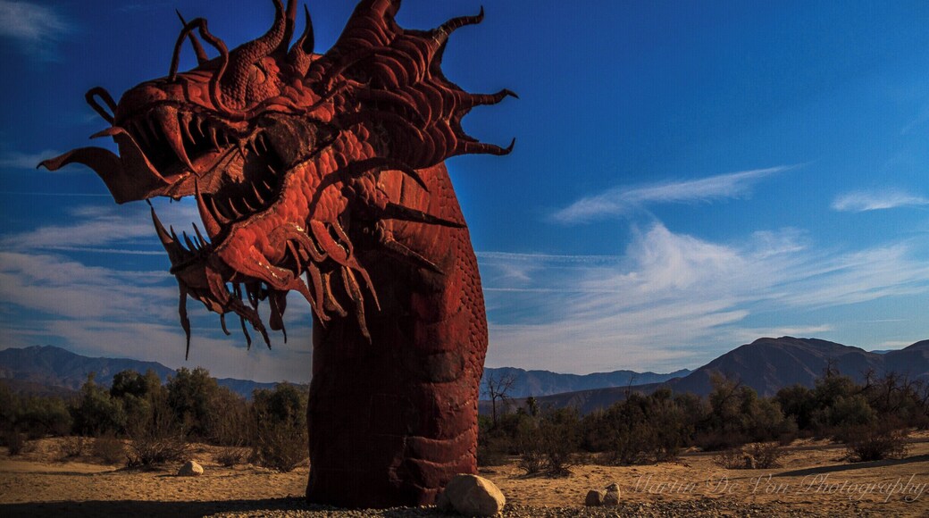 Something more than desert wildflowers and the spectacular Anza-Borrego Desert State Park is attracting visitors to the Borrego Valley in Southern California. People are coming from around the United States and internationally to see the amazing 130 full-sized metal sculptures here that are inspired by creatures that roamed this same desert millions of years ago. The artworks range from prehistoric mammals to historical characters, fanciful dinosaurs, and a 350-foot-long fanciful serpent.
As you drive through the roads that weave through the area you'll see sculptures of wild horses in a nearby field, sabertooth tigers in pursuit, and desert tortoises that seem as if they're crawling through the brush. The artist, Ricardo Breceda, brings life to his sculptures by capturing each creature in motion. They are so still, yet all you see is movement.
The late Dennis Avery, land owner of Galleta Meadows Estates in Borrego Springs envisioned the idea of adding 'free standing art' to his property with original steel welded sculptures created by 'Perris Jurassic Park' owner/artist/welder Ricardo Breceda based in Perris, California. There are over 130 metal sculptures located in Borrego Springs.