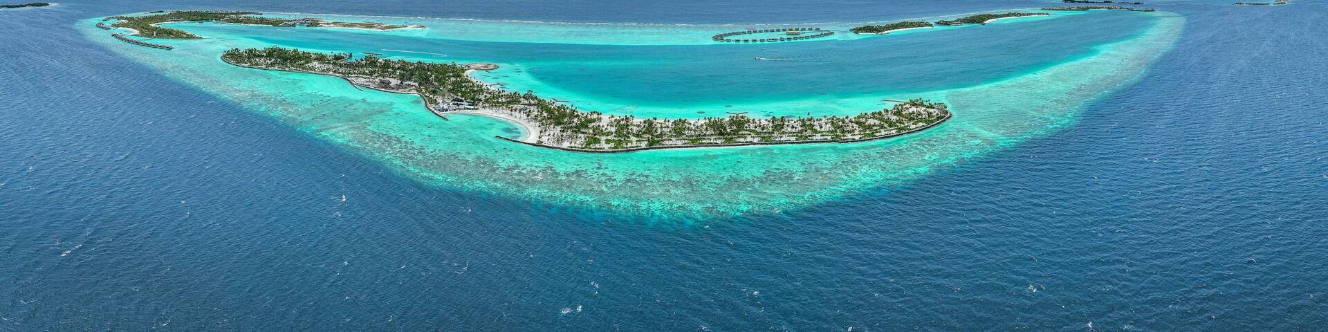 Panoramic aerial view of Fari Island surrounded by the Indian Ocean, Maldives archipelagos.