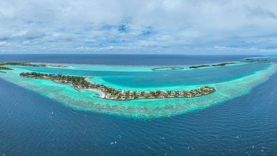 Panoramic aerial view of Fari Island surrounded by the Indian Ocean, Maldives archipelagos.