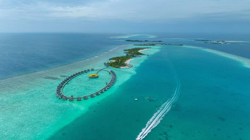Malè, Maldives - 21 December 2023: Aerial view of The Ritz Carlton Luxury Hotel and resort on Fari Island, Maldives.