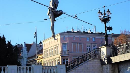 "Man crossing the River" was unveiled on the 1st of May 2004 to commemorate the Polish entry into the European Union. The sculpture was placed on a rope stretched between the banks of the Brda river and was designed so that its centre of gravity is below the wire, which gives it its balance. #LocalSecrets #History
