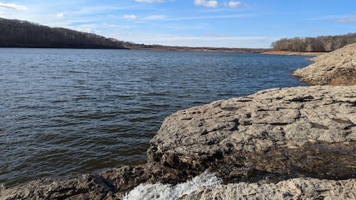 Looking out over the Coralville, Iowa reservoir in the winter you can see fossils and the Devonian rock layers reviled by recent floods in the area.