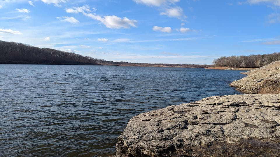 Looking out over the Coralville, Iowa reservoir in the winter you can see fossils and the Devonian rock layers reviled by recent floods in the area.