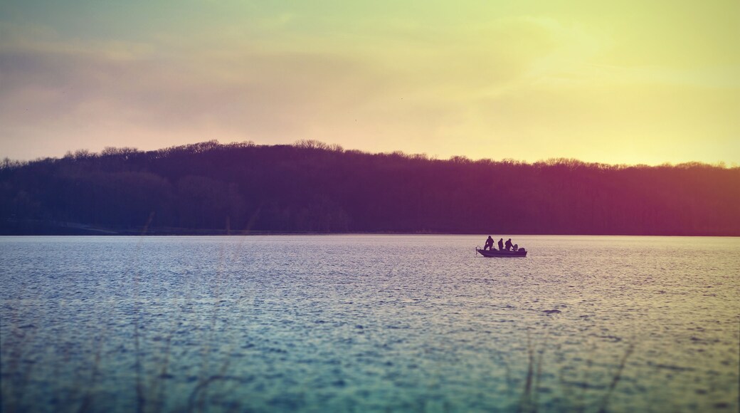 Fishermen on a boat at Lake McBride after sunset
