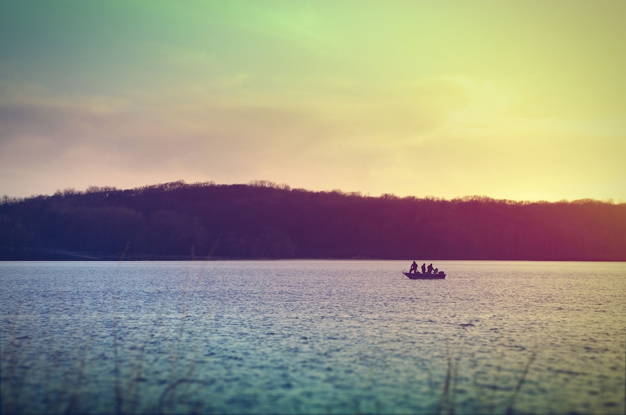 Fishermen on a boat at Lake McBride after sunset