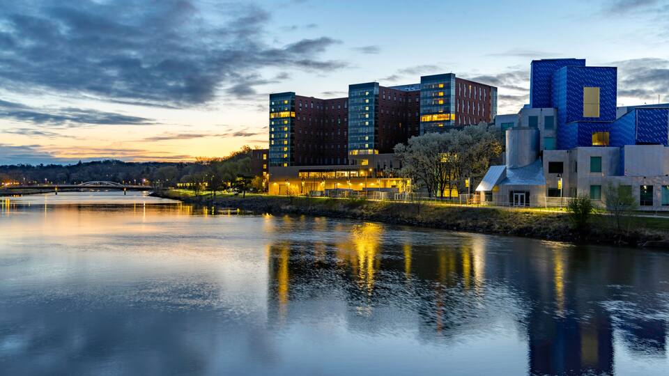 Reflections of Iowa City in the Iowa River at Sunrise