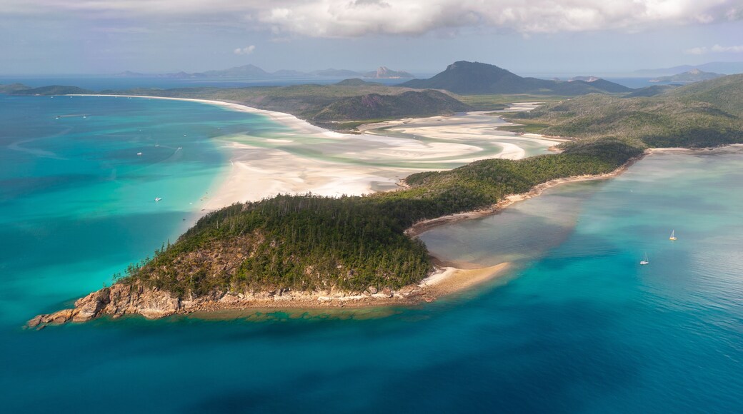 Aerial shot of Hill Inlet over Whitsunday Island - swirling white sands, sail boats and blue green water