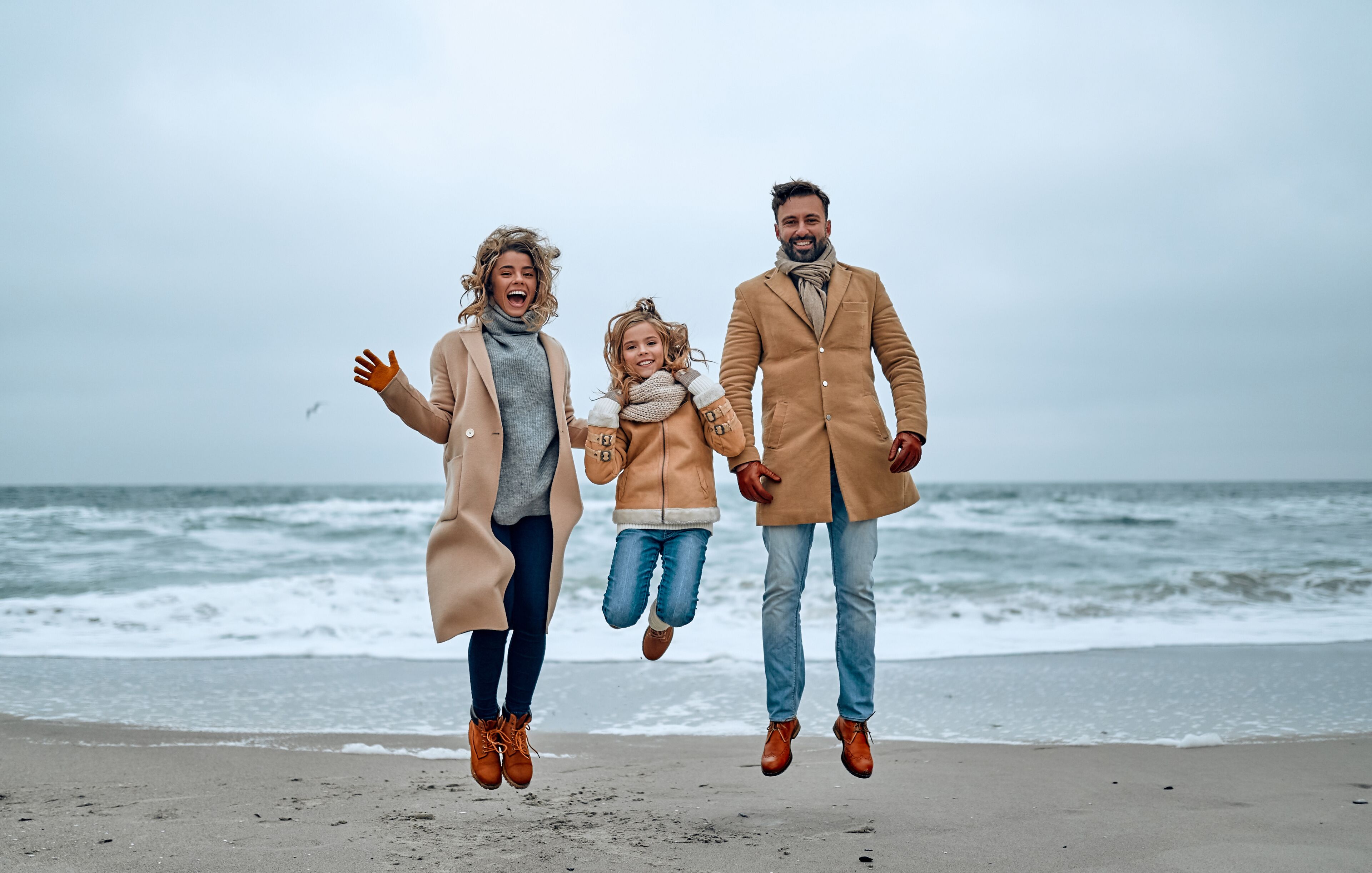 Family on the beach near the sea
