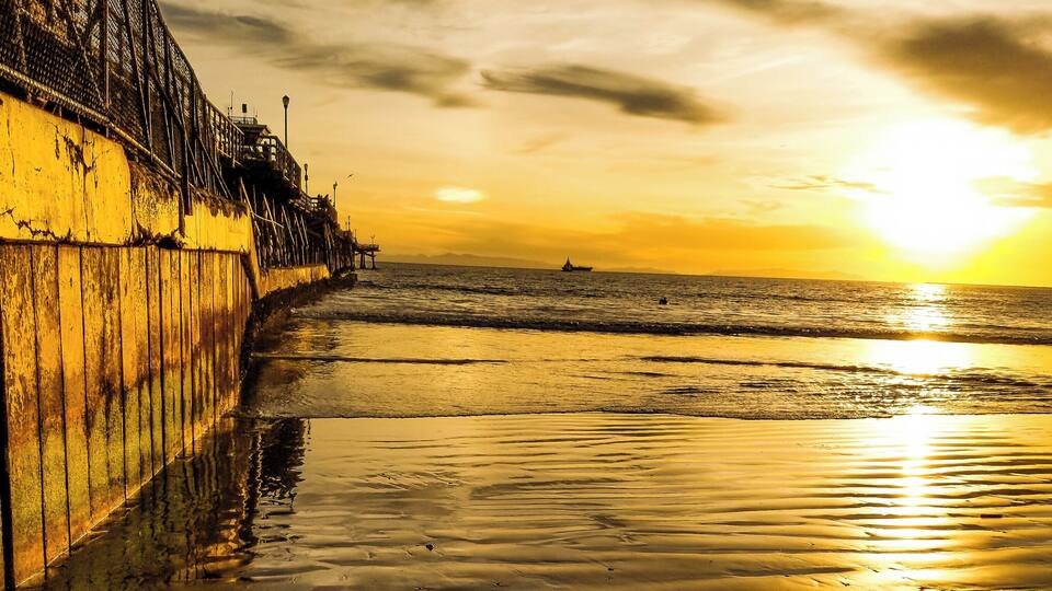 There's nothing like bare feet in the sand at sunset. This is a view down the side of the Seal Beach Pier in California. A great beach and very peaceful at sunset. #LifeAtExpedia #Nature