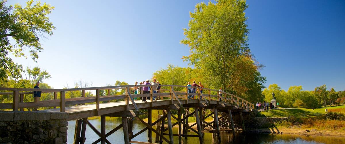 Concord showing a bridge, a park and a river or creek