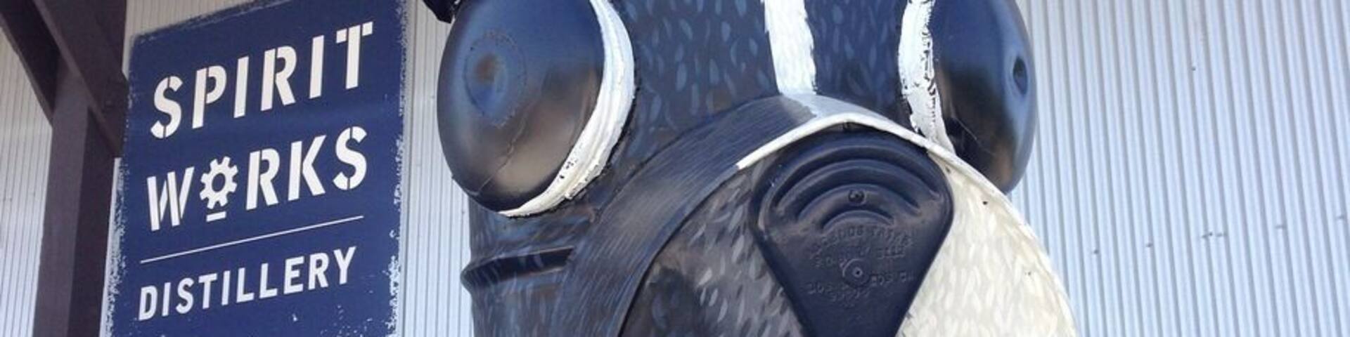 Fun surfing dog in front of the Spirit Works Distillery in Sebastopol.