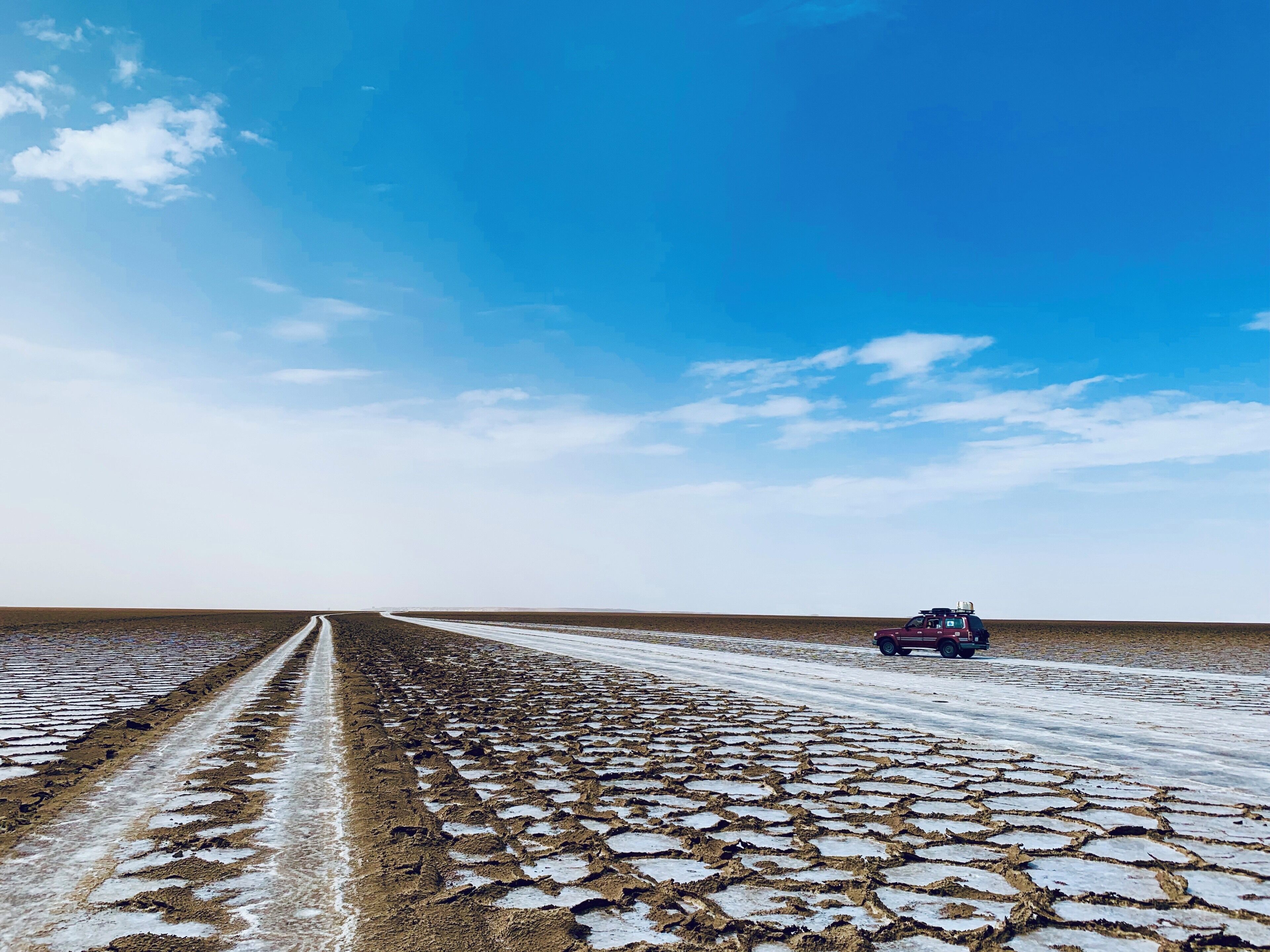A vast area of salt and earth covers the Danakil Depression.  The horizon was endless and the sky an otherworldly blue.  #Adventure