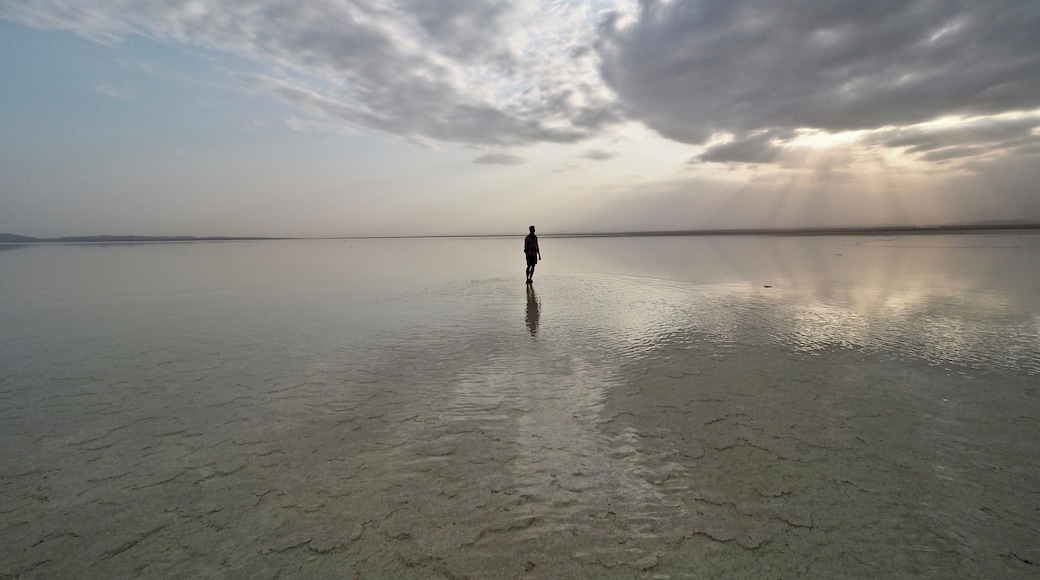 Evening at the salt lake Karum in Danakil Depression, Ethiopia with the same shallow water all around.