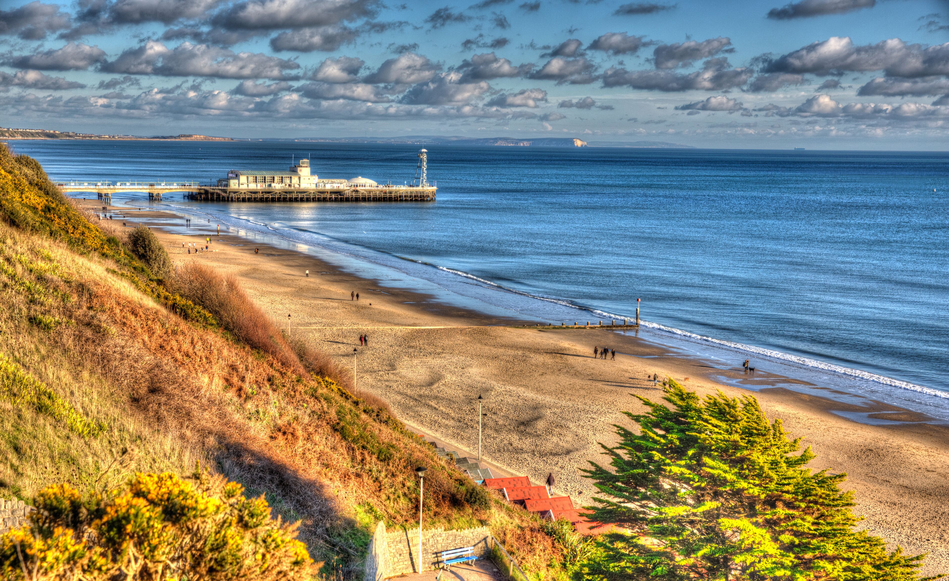 Bournemouth beach pier and coast Dorset England UK like a painting in vivid bright colour HDR
