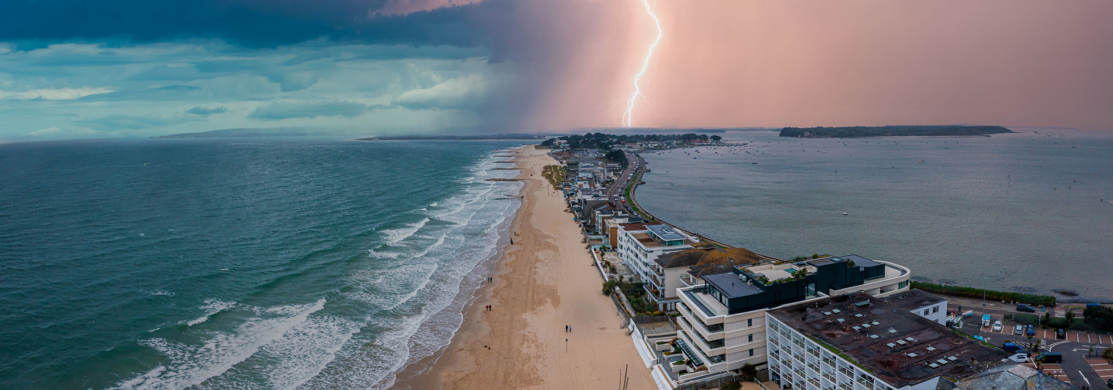 Flying over cloudy stormy beach in Bournemouth, England. Cloudy stormy nature.