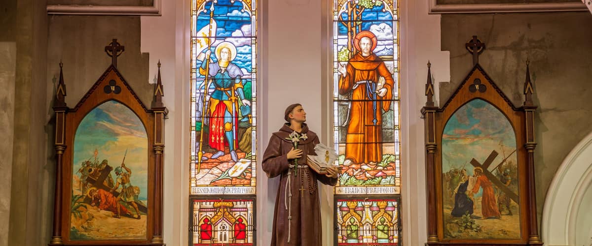 Saints Mary & Joseph Catholic Cathedral showing a statue or sculpture, interior views and heritage elements