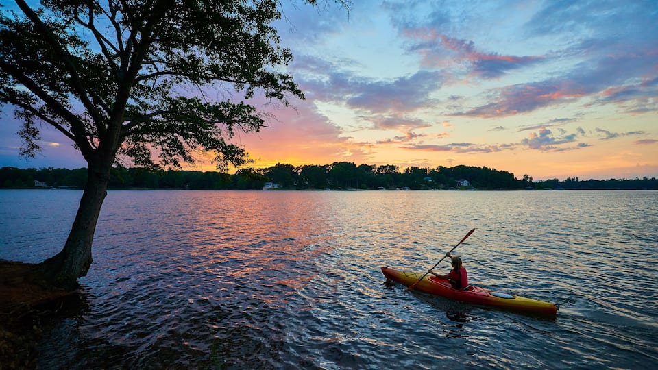 Female Kayaker on Lake Keowee at Sunset