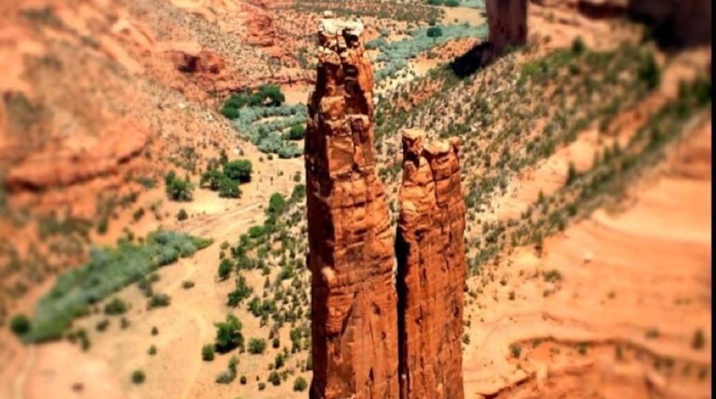 "The park's distinctive geologic feature, Spider Rock, is a sandstone spire that rises 800 feet (240 m) from the canyon floor at the junction of Canyon de Chelly and Monument Canyon. Spider Rock can be seen from South Rim Drive. According to traditional Navajo beliefs the taller of the two spires is the home of Spider Grandmother." -wiki-