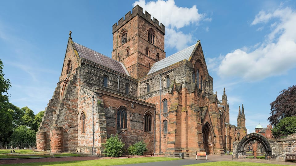 A historic church with a prominent tower and arched windows.