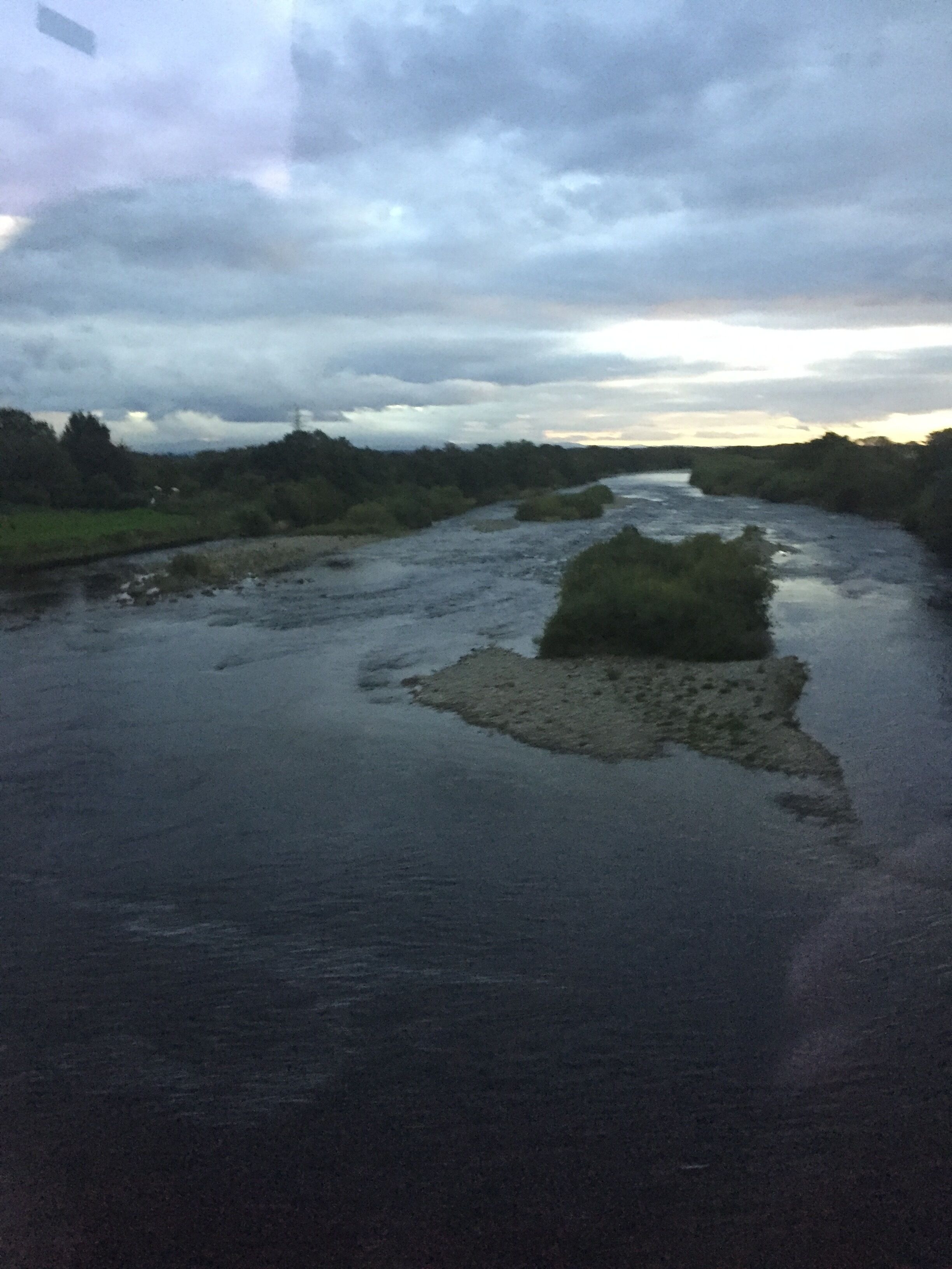 A river with a small island in the middle.