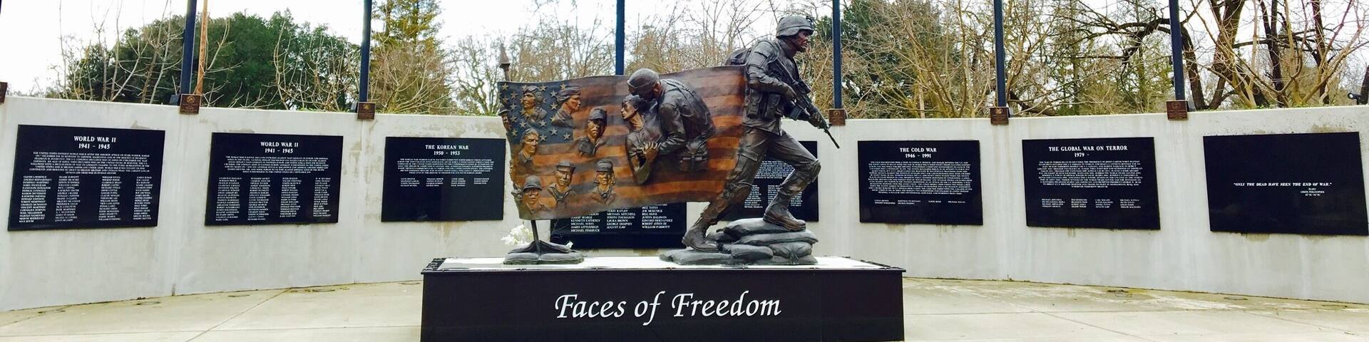 Dedicated November 8, 2008, the Atascadero Faces of Freedom Veterans Memorial honors our military members and signifies that we will be forever proud of our Veterans. The Heroes Wall and adjacent Scroll of Honor is a 70 foot, curved wall with descriptions of the US conflicts since WW1 and engraved names of the 231 fallen soldiers of San Luis Obispo County.