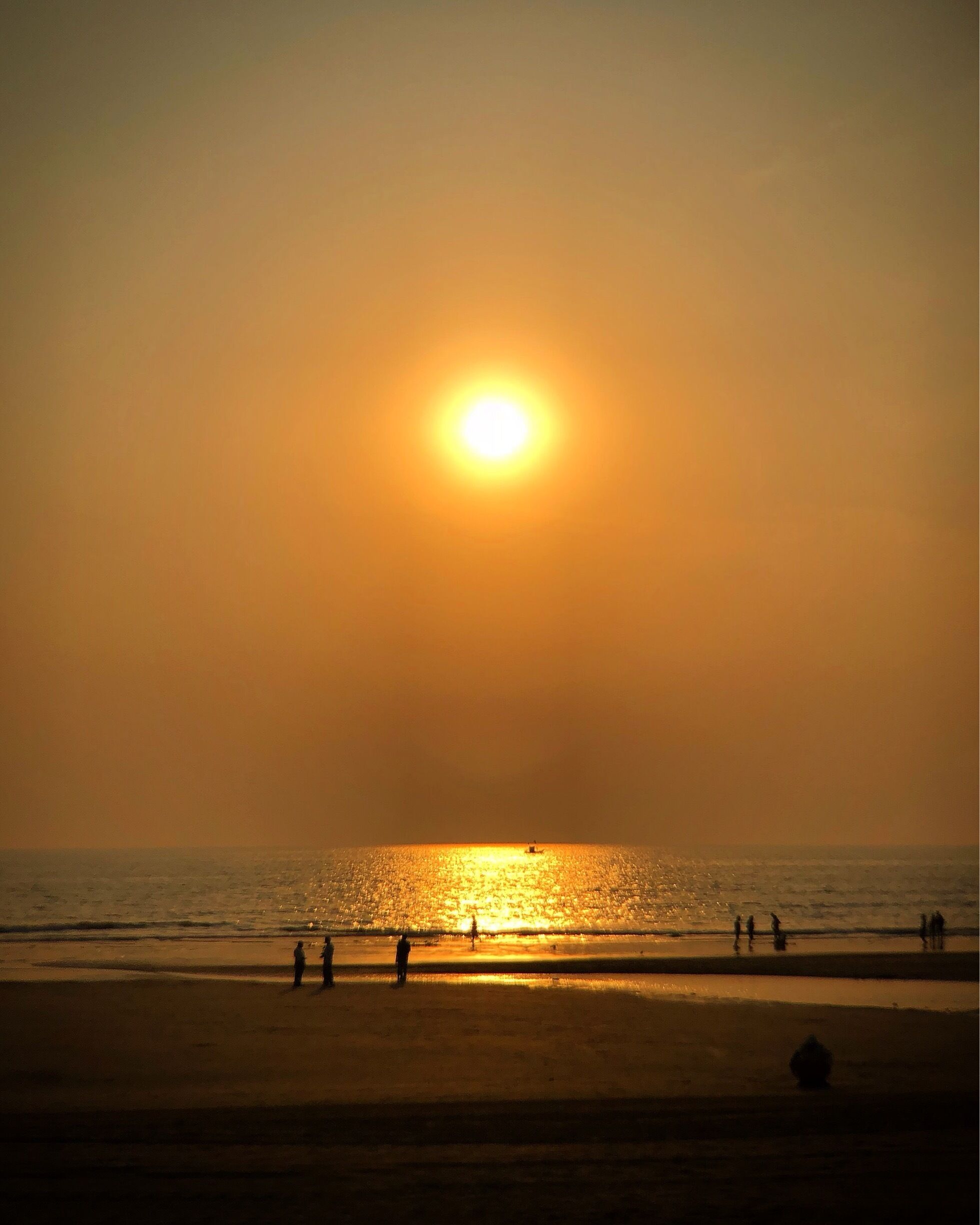 Juhu Beach, Mumbai, India. Saturday night in Mumbai. Lots of people walking the beach.