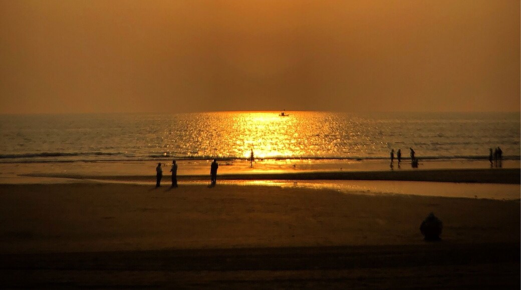Juhu Beach, Mumbai, India. Saturday night in Mumbai. Lots of people walking the beach.