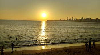 Enjoying sunset at Marine Drive Mumbai. It appears as if sun is about to touch the city line..