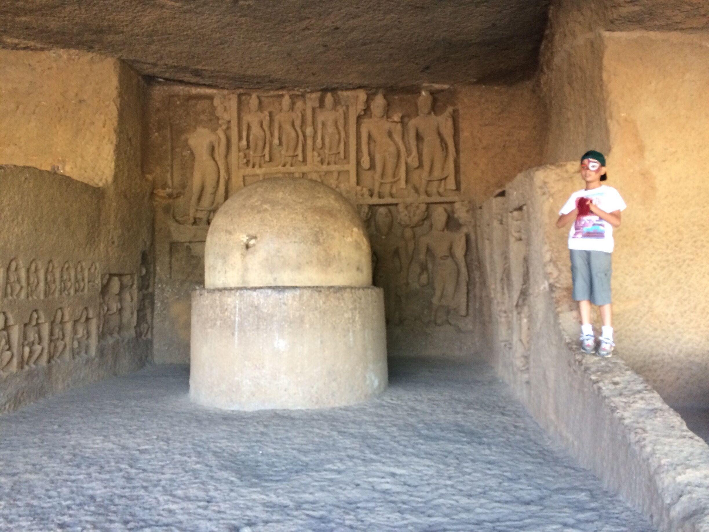 The Kanheri Caves (Sanskrit: कान्हेरीगुहाः Kānherī-guhāḥ) constitute a group of rock-cut monuments that are located to the north of Borivali on the western outskirts of Mumbai, India. 
Located within the forests of the Sanjay Gandhi National Park, 
The Kanheri Caves demonstrate the Buddhist influence on the art and culture of India. 
Kanheri comes from the Sanskrit Krishnagiri, which means black mountain. They were chiseled out of a massive basaltic rock outcropping.
These caves date from the first century BCE to the 10th century CE.