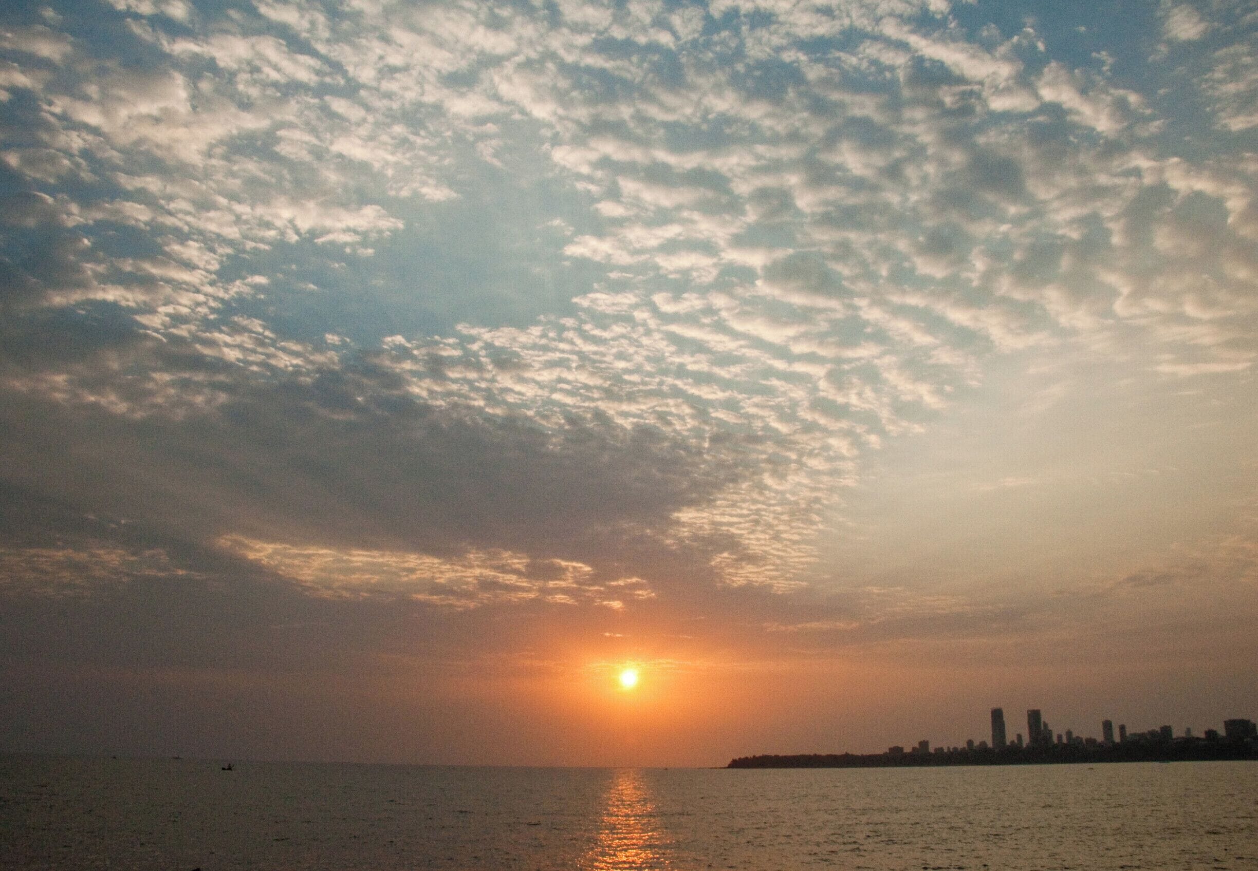 Sunset at Mumbai City, overlooking the sea and the city skyline. #sunset #mumbai #sky #sea #clouds #india