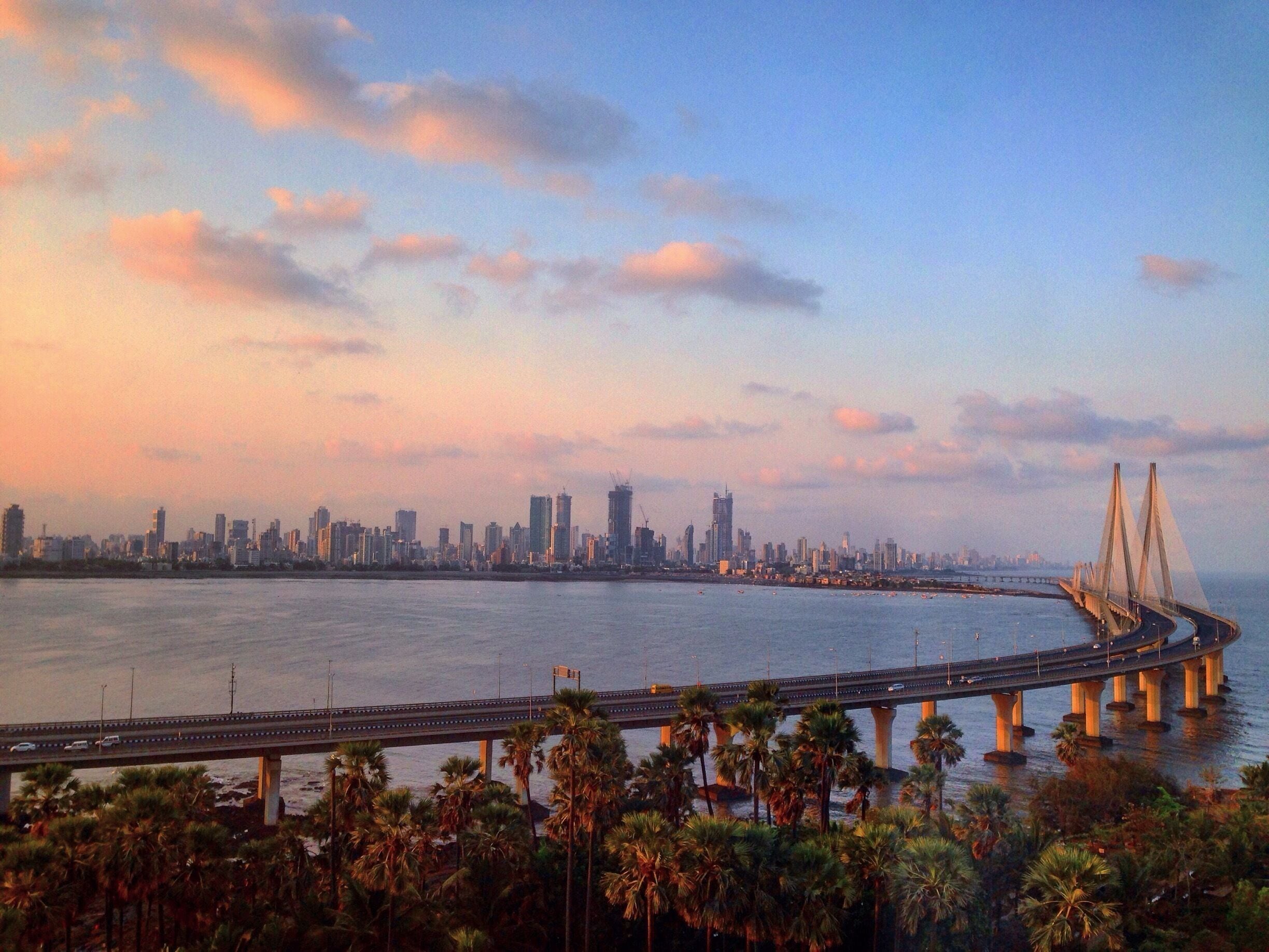Beautiful morning looking over the Worli skyline reflecting over the Arabian Sea in Mumbai.
