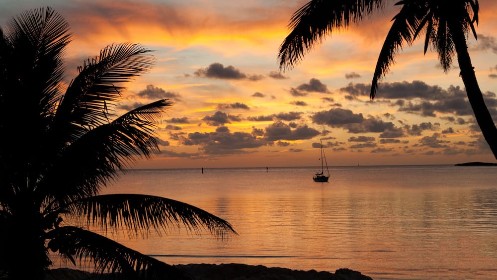 Beautiful sunset from the beach in Chub Cay, Bahamas with my sailboat Arcturus in the background.