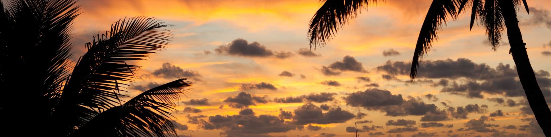 Beautiful sunset from the beach in Chub Cay, Bahamas with my sailboat Arcturus in the background.